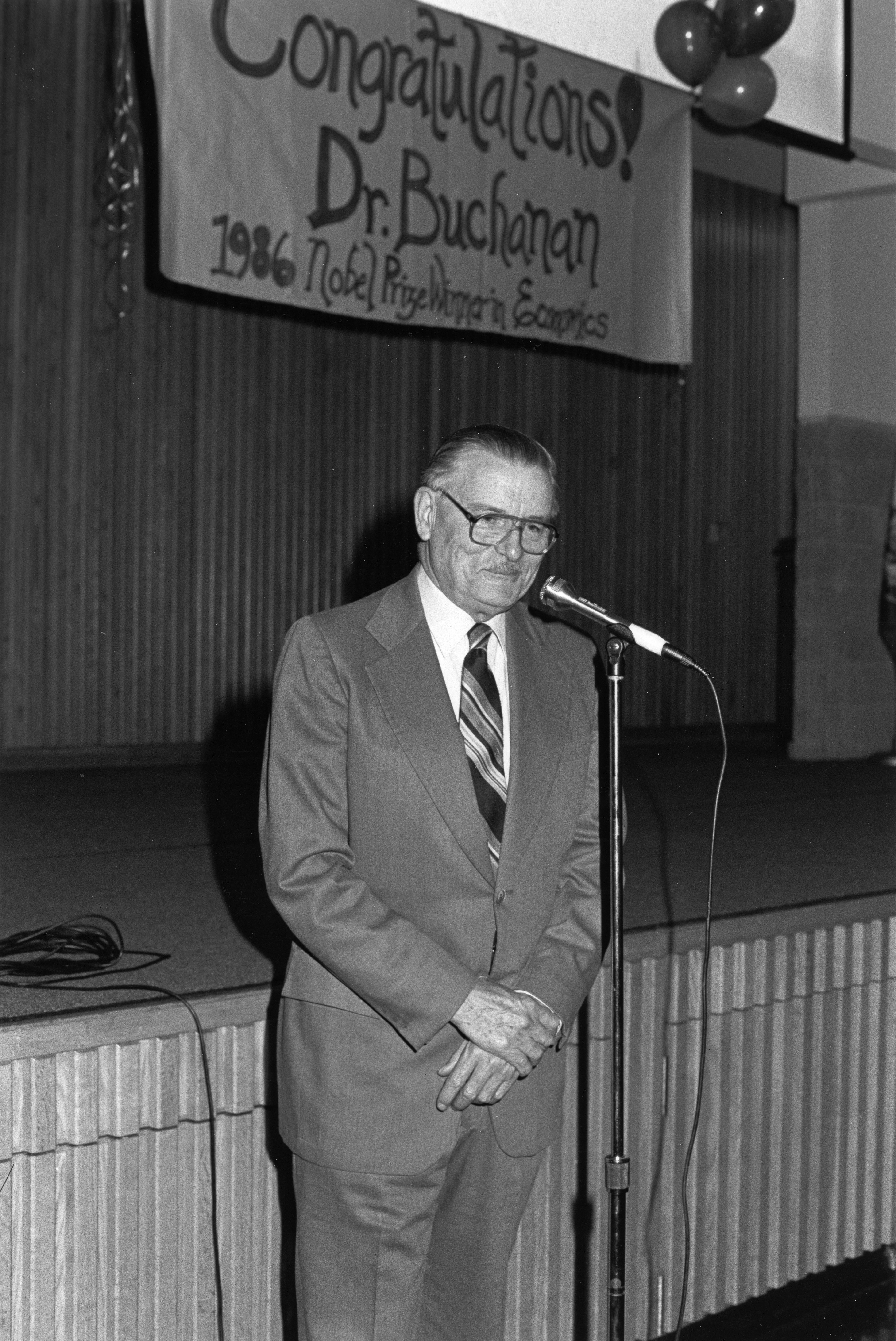 James Buchanan speaks at a reception on the Fairfax Campus congratulating him on the Nobel Prize, 1986.